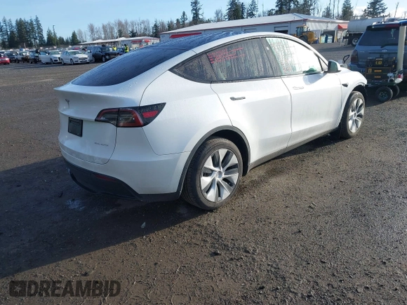 2024 Tesla Model Y Long Range with VIN 7SAYGDEE1RF056816, listed as a IAAI auction lot 41809125 with 6,434 mi miles and . Bid and sale history available at DreamBid. Image 4.