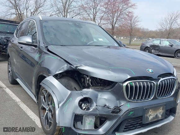 2019 BMW X1 xDrive28i with VIN WBXHT3C51K5L90571, listed as a IAAI auction lot 41909209 with 35,902 mi miles. Bid and sale history available at carsss.com. Image 1.