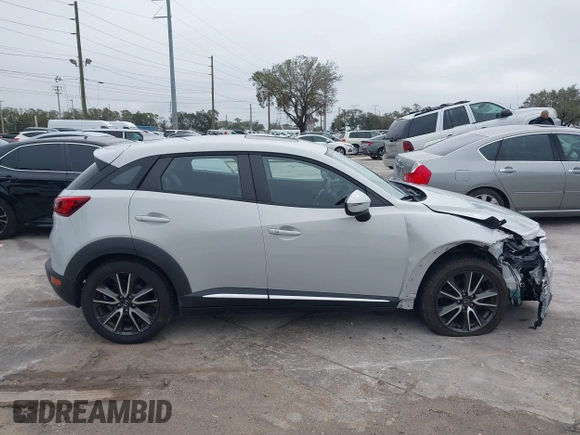 2016 Mazda CX-3 Grand Touring with VIN JM1DKDD72G0128891, listed as a IAAI auction lot 41401456 with 60,911 mi miles. Bid and sale history available at carsss.com. Image 13.