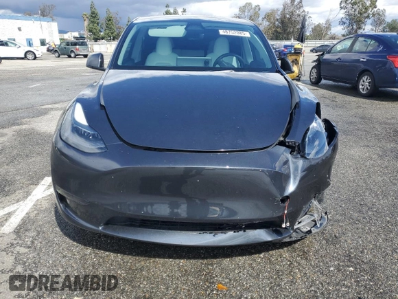 2024 Tesla Model Y z VIN 7SAYGDED1RF089192, wystawiony jako Copart lot #48752085 z przebiegiem 7 643 mil mil oraz Szkoda całkowita • Salvage title. Historia ofert i sprzedaży dostępna na DreamBid. Obrazek 5.