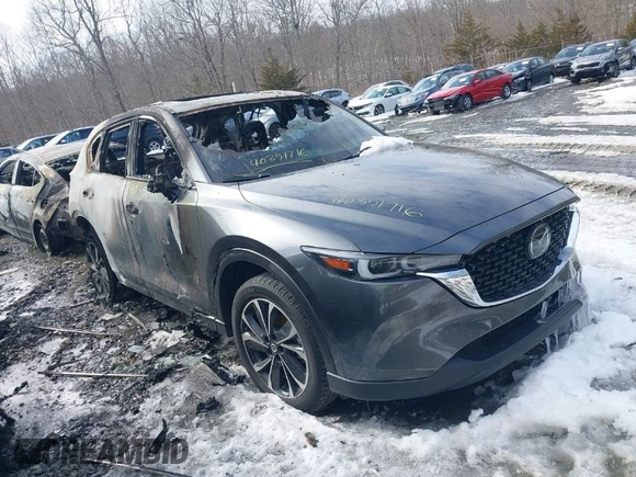 2023 Mazda CX-5 2.5 S Premium Package with VIN JM3KFBDM5P0267412, listed as a IAAI auction lot 40351716 with 7,306 mi miles. Bid and sale history available at carsss.com. Image 1.