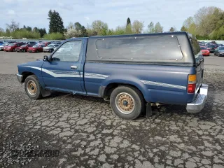 1990 Toyota Pickup DX с VIN JT4RN81P7L5065454, выставлен на аукционе Copart как лот 52913465 с пробегом 366 591 миль миль и Списание • Salvage title. История ставок и продаж доступна на DreamBid. Изображение 2.