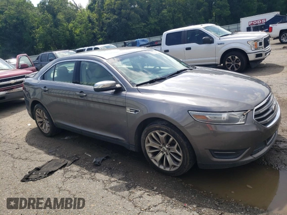 2014 Ford Taurus Limited with VIN 1FAHP2F84EG149622, listed as a Copart auction lot 63764675 with 208,801 mi miles and Salvage title. Bid and sale history available at DreamBid. Image 4.
