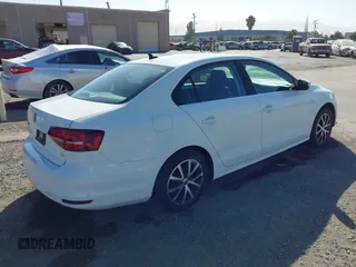 2017 Volkswagen Jetta SE with VIN 3VWDB7AJ9HM384202, listed as a IAAI auction lot 42543807 with 92,914 mi miles and . Bid and sale history available at DreamBid. Image 4.