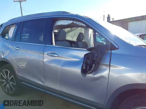 2019 Honda Pilot Touring 7-Passenger with VIN 5FNYF6H60KB038846, listed as a IAAI auction lot 41339385 with Not provided miles and . Bid and sale history available at DreamBid. Image 13.