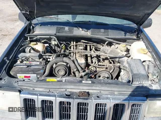 1997 Jeep Grand Cherokee Laredo with VIN 1J4GZ58S4VC633205, listed as a IAAI auction lot 41727571 with 201,228 mi miles. Bid and sale history available at carsss.com. Image 10.