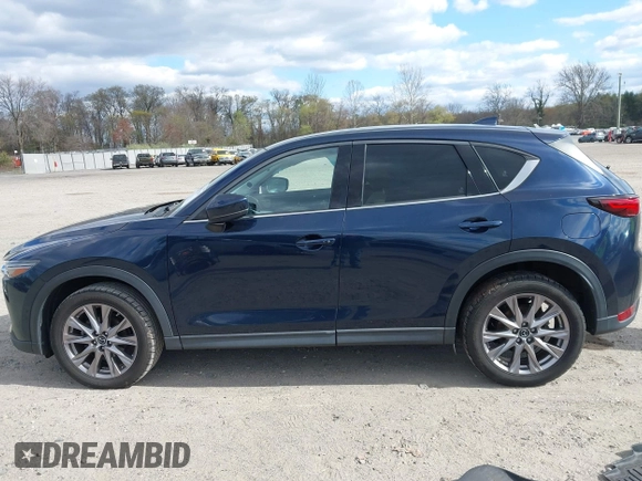 2019 Mazda CX-5 Grand Touring with VIN JM3KFBDM2K0603400, listed as a IAAI auction lot 42051135 with 59,448 mi miles and . Bid and sale history available at DreamBid. Image 14.
