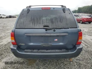 2004 Jeep Grand Cherokee Laredo with VIN 1J4GX48SX4C201569, listed as a Copart auction lot 58631585 with 271,124 mi miles and Salvage title. Bid and sale history available at DreamBid. Image 6.