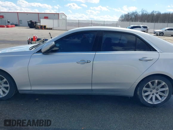 2015 Cadillac CTS RWD with VIN 1G6AP5SX5F0115745, listed as a IAAI auction lot 41658935 with 62,477 mi miles and . Bid and sale history available at DreamBid. Image 14.
