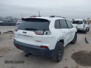 2019 Jeep Cherokee Trailhawk with VIN 1C4PJMBN6KD124023, listed as a IAAI auction lot 41432217 with 76,934 mi miles and . Bid and sale history available at DreamBid. Image 4.