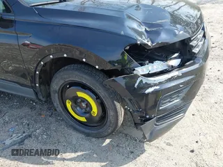 2020 Volkswagen Tiguan S z VIN 3VV1B7AX7LM058984, wystawiony jako IAAI lot #42045211 z przebiegiem 77 293 mil mil oraz . Historia ofert i sprzedaży dostępna na DreamBid. Obrazek 17.