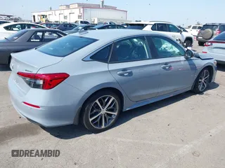 2023 Honda Civic Touring with VIN 2HGFE1F92PH322377, listed as a IAAI auction lot 42361473 with 43,533 mi miles and . Bid and sale history available at DreamBid. Image 4.