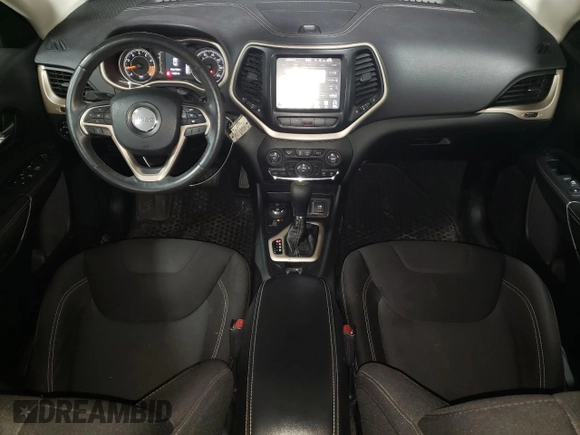 2015 Jeep Cherokee Latitude with VIN 1C4PJMCS5FW624799, listed as a Copart auction lot 52339795 with 142,681 mi miles and Salvage Title. Bid and sale history available at DreamBid. Image 8.