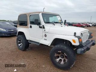 2001 Jeep Wrangler Sahara with VIN 1J4FA59S71P365271, listed as a IAAI auction lot 41889948 with 144,357 mi miles. Bid and sale history available at carsss.com. Image 1.