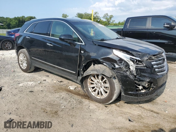 2017 Cadillac XT5 FWD with VIN 1GYKNARS0HZ283618, listed as a Copart auction lot 61640005 with 113,823 mi miles and Salvage title. Bid and sale history available at DreamBid. Image 4.