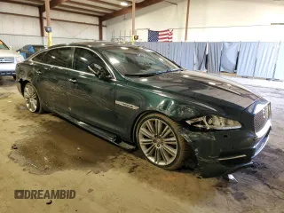 2014 Jaguar XJ with VIN SAJWA2GTXEMV72147, listed as a Copart auction lot 44854485 with 103,814 mi miles and Salvage Title. Bid and sale history available at DreamBid. Image 4.