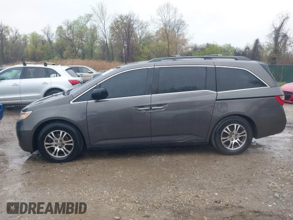 2012 Honda Odyssey EX-L with VIN 5FNRL5H6XCB057557, listed as a IAAI auction lot 42022410 with 174,286 mi miles and . Bid and sale history available at DreamBid. Image 14.