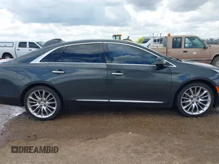 2013 Cadillac XTS Platinum z VIN 2G61V5S32D9102537, wystawiony jako IAAI lot #42230895 z przebiegiem 120 810 mil mil oraz . Historia ofert i sprzedaży dostępna na DreamBid. Obrazek 13.