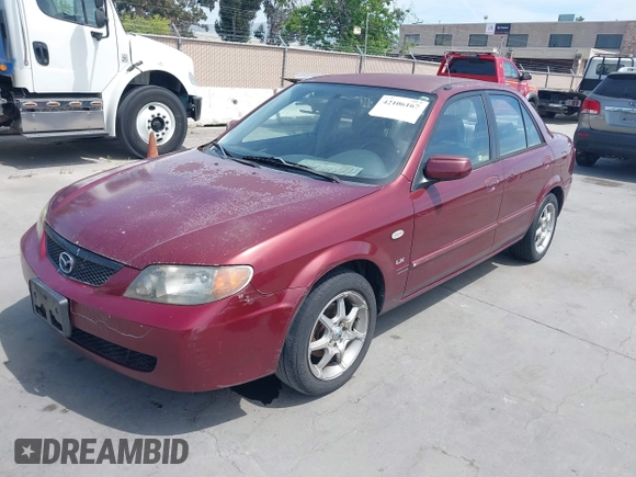2002 Mazda Protege DX with VIN JM1BJ225621608984, listed as a IAAI auction lot 42106167 with 158,662 mi miles and . Bid and sale history available at DreamBid. Image 2.