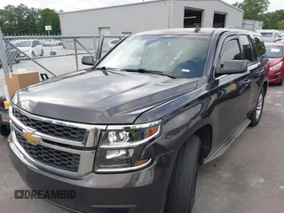 2015 Chevrolet Tahoe LS with VIN 1GNSCAKC0FR245826, listed as a IAAI auction lot 42282590 with 164,208 mi miles and . Bid and sale history available at DreamBid. Image 2.