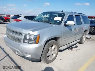 2012 Chevrolet Suburban LT with VIN 1GNSCJE01CR220186, listed as a IAAI auction lot 41476520 with 117,714 mi miles. Bid and sale history available at carsss.com. Image 2.
