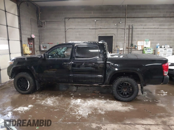 2016 Toyota Tacoma SR with VIN 3TMCZ5AN5GM037336, listed as a IAAI auction lot 41599492 with 76,262 mi miles. Bid and sale history available at carsss.com. Image 14.