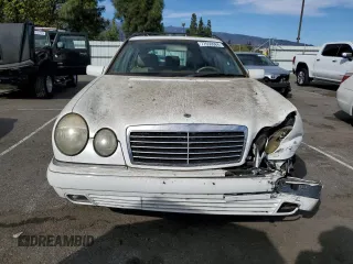 1999 Mercedes-Benz E-Class with VIN WDBJH65F3XA749696, listed as a Copart auction lot 77656084 with 163,802 mi miles and Salvage Title. Bid and sale history available at carsss.com. Image 5.