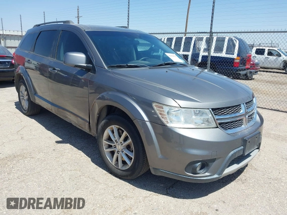 2013 Dodge Journey SXT with VIN 3C4PDCBB4DT563709, listed as a IAAI auction lot 42019033 with 201,188 mi miles. Bid and sale history available at carsss.com. Image 1.