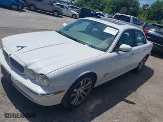 2004 Jaguar XJ with VIN SAJWA73BX4TG14270, listed as a IAAI auction lot 41905325 with 104,908 mi miles. Bid and sale history available at carsss.com. Image 2.