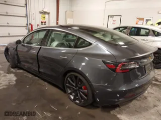 2020 Tesla Model 3 Performance with VIN 5YJ3E1EC3LF641768, listed as a IAAI auction lot 41542615 with 43,343 mi miles. Bid and sale history available at carsss.com. Image 3.