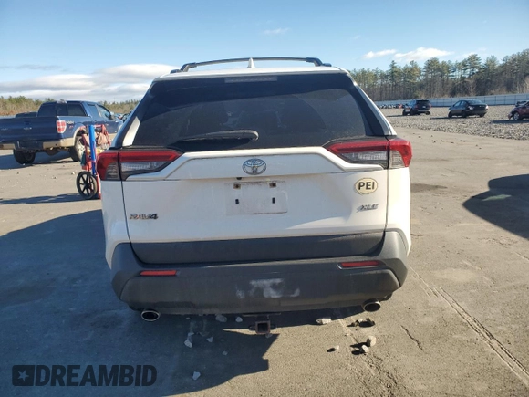 2019 Toyota RAV4 XLE with VIN JTMW1RFV4KD021007, listed as a Copart auction lot 82208754 with 96,998 mi miles and Salvage Title. Bid and sale history available at carsss.com. Image 6.