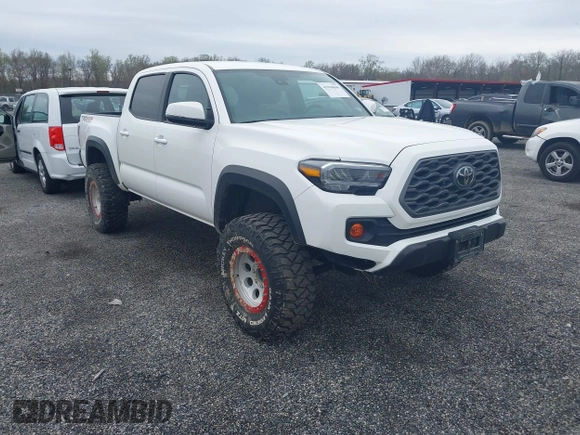 2023 Toyota Tacoma SR with VIN 3TMCZ5AN2PM641846, listed as a IAAI auction lot 41948660 with 21,969 mi miles and . Bid and sale history available at DreamBid. Image 1.