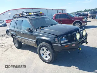 2004 Jeep Grand Cherokee Laredo z VIN 1J4GX48S04C281660, wystawiony jako IAAI lot #42551161 z przebiegiem 173 209 mil mil oraz . Historia ofert i sprzedaży dostępna na DreamBid. Obrazek 1.