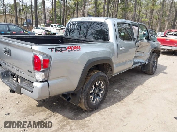 2022 Toyota Tacoma SR with VIN 3TMCZ5ANXNM497511, listed as a IAAI auction lot 41670710 with 26,277 mi miles and . Bid and sale history available at DreamBid. Image 4.