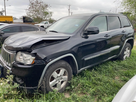 2012 Jeep Grand Cherokee Laredo with VIN 1C4RJEAG8CC119401, listed as a IAAI auction lot 41724335 with 233,265 mi miles. Bid and sale history available at carsss.com. Image 2.