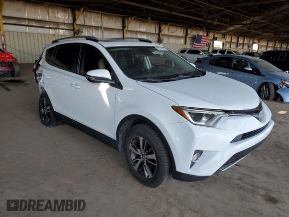 2018 Toyota RAV4 XLE with VIN JTMWFREV2JJ740145, listed as a Copart auction lot 52214075 with 129,940 mi miles and Salvage title. Bid and sale history available at DreamBid. Image 4.