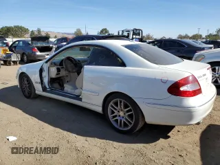 2009 Mercedes-Benz CLK-Class 3.5L with VIN WDBTJ56H39F264312, listed as a Copart auction lot 76835154 with 125,624 mi miles and Salvage Title. Bid and sale history available at carsss.com. Image 2.