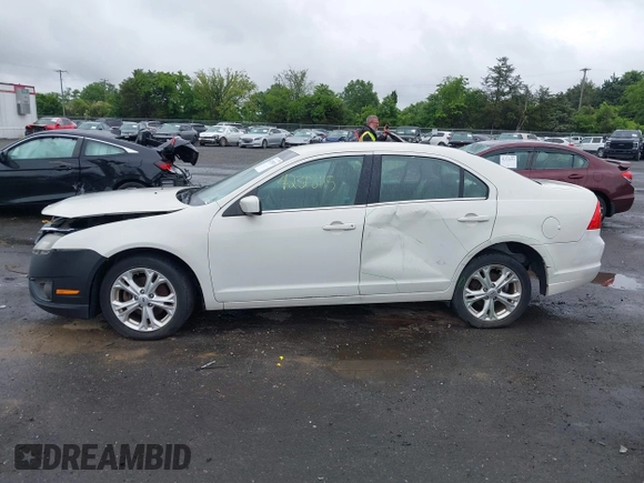 2012 Ford Fusion SE z VIN 3FAHP0HA4CR261668, wystawiony jako IAAI lot #42318115 z przebiegiem 81 923 mil mil oraz . Historia ofert i sprzedaży dostępna na DreamBid. Obrazek 14.