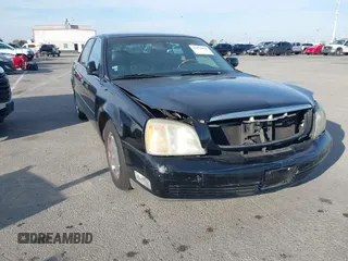 2002 Cadillac DeVille DHS z VIN 1G6KE57YX2U291009, wystawiony jako IAAI lot #41578425 z przebiegiem 107 186 mil mil oraz . Historia ofert i sprzedaży dostępna na DreamBid. Obrazek 1.