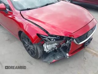 2016 Mazda 6 i Grand Touring z VIN JM1GJ1W58G1486694, wystawiony jako IAAI lot #42094443 z przebiegiem 77 803 mil mil oraz . Historia ofert i sprzedaży dostępna na DreamBid. Obrazek 6.