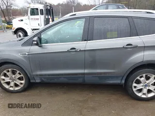 2015 Ford Escape Titanium with VIN 1FMCU9JX6FUB79093, listed as a IAAI auction lot 41805057 with 87,788 mi miles. Bid and sale history available at carsss.com. Image 14.