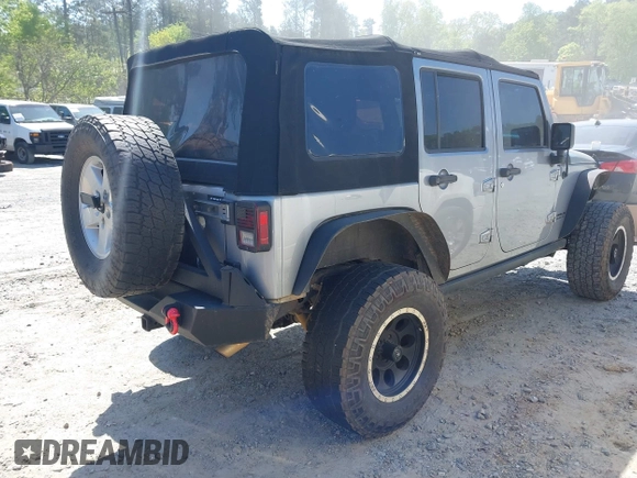 2014 Jeep Wrangler Unlimited Sport with VIN 1C4BJWDG4EL292421, listed as a IAAI auction lot 42034343 with 157,820 mi miles. Bid and sale history available at carsss.com. Image 4.