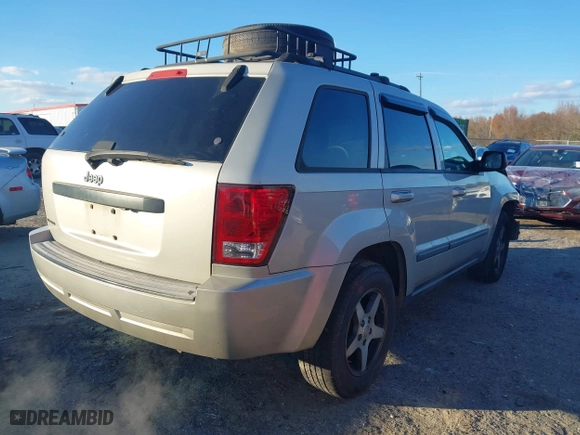 2007 Jeep Grand Cherokee Laredo with VIN 1J8GS48K07C630303, listed as a IAAI auction lot 40993022 with 254,294 mi miles. Bid and sale history available at carsss.com. Image 4.