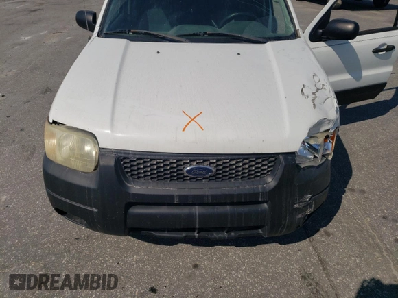 2004 Ford Escape XLS with VIN 1FMYU021X4DA07352, listed as a Copart auction lot 68909864 with 275,776 mi miles and Salvage Title. Bid and sale history available at DreamBid. Image 13.