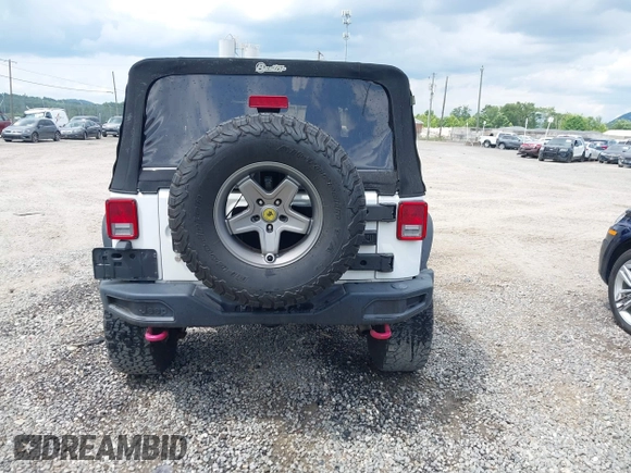 2012 Jeep Wrangler Sport z VIN 1C4AJWAG5CL171961, wystawiony jako IAAI lot #42590232 z przebiegiem 126 372 mil mil oraz . Historia ofert i sprzedaży dostępna na DreamBid. Obrazek 16.