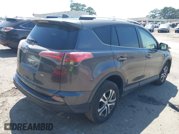 2016 Toyota RAV4 LE with VIN JTMZFREV7GJ086149, listed as a IAAI auction lot 42064251 with 90,104 mi miles and . Bid and sale history available at DreamBid. Image 4.