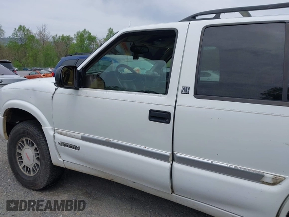 1999 GMC Jimmy SLE with VIN 1GKDT13WXX2521082, listed as a IAAI auction lot 42079903 with 160,055 mi miles. Bid and sale history available at carsss.com. Image 12.