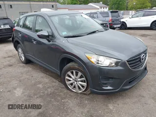 2016 Mazda CX-5 Sport z VIN JM3KE4BY9G0710004, wystawiony jako IAAI lot #42323434 z przebiegiem 83 320 mil mil oraz . Historia ofert i sprzedaży dostępna na DreamBid. Obrazek 1.