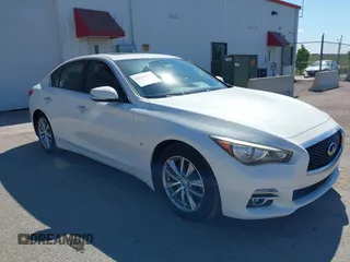 2014 Infiniti Q50 Premium z VIN JN1BV7AP6EM682870, wystawiony jako IAAI lot #42348262 z przebiegiem 80 269 mil mil oraz . Historia ofert i sprzedaży dostępna na DreamBid. Obrazek 1.