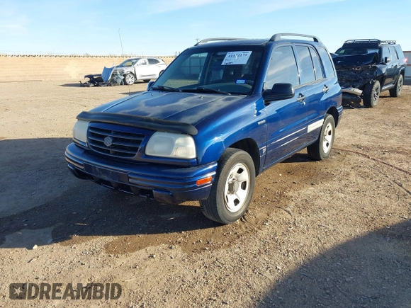2003 Suzuki Vitara z VIN 2S3TE52V436101091, wystawiony jako IAAI lot #41472279 z przebiegiem 163 429 mil mil oraz . Historia ofert i sprzedaży dostępna na DreamBid. Obrazek 2.